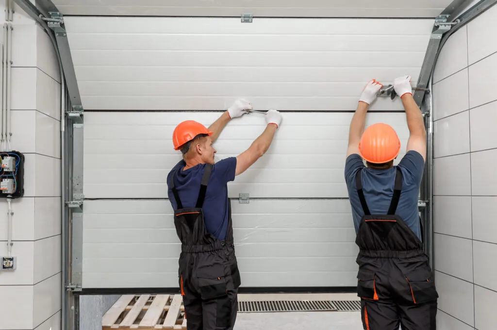 workers-are-installing-lifting-gates-garage